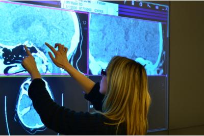 Fig. 2. A user performing a Zoom gesture on the wall-sized display.