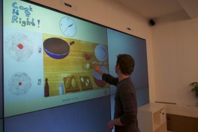 A Cognitive Training Game in an Ambient Assisted Living Environment